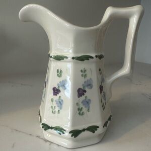Small ceramic pitcher or vase with floral detail